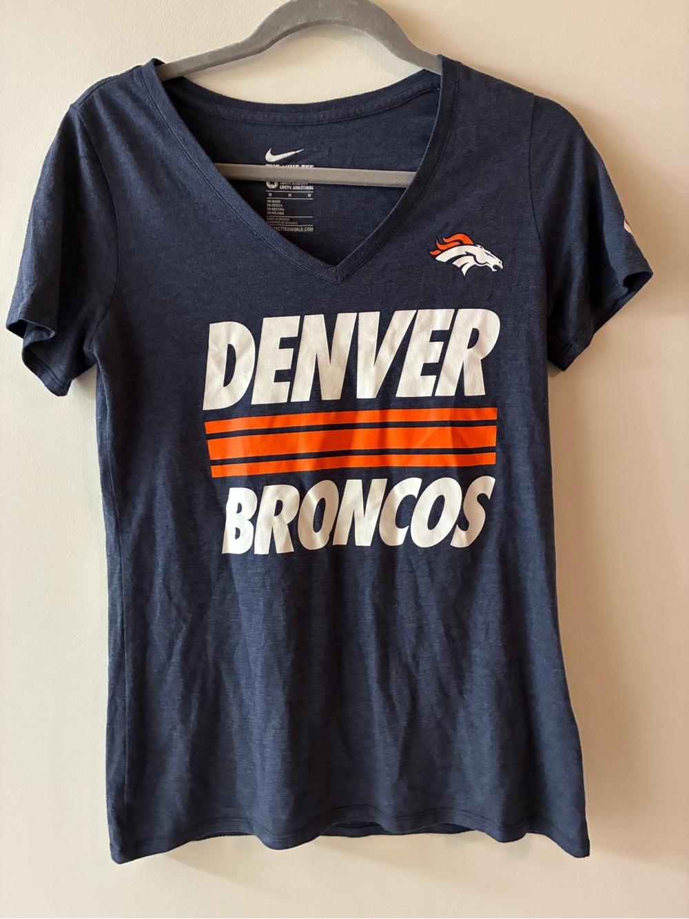 The Nike Tee Women’s Navy Denver Broncos V-Neck Tee with White & Orange Logos